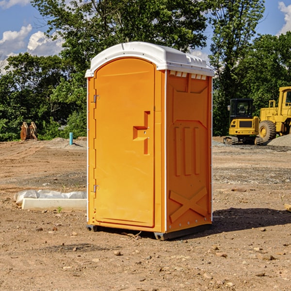 what is the cost difference between standard and deluxe portable restroom rentals in Rushville